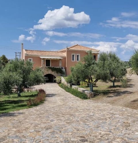 Private entrance to the villa, with lush garden