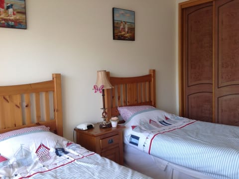 twin bedroom with sliding doors to small terrace and b/q