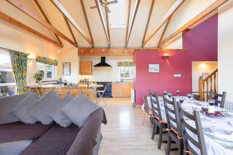 Capacious kitchen-living area with comfy seating - ideal for entertaining