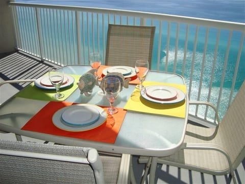 Have your breakfast at this table with festive dinnerware overlooking gulf