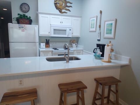 Kitchen and bar seating area.