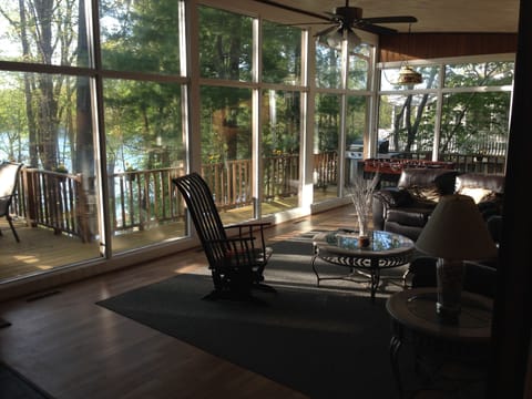 View from the atrium into the living room and out onto the deck and waterfront