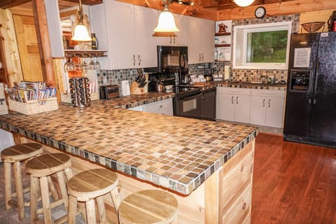 Large kitchen, stone counters and all the utensils to cook a great family meal! 