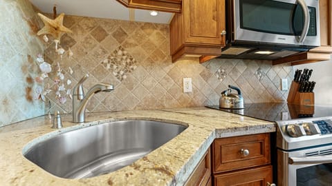 Corner sink allows for maximum efficiency & working space.