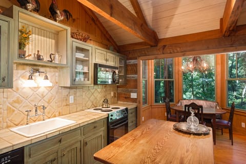 Full kitchen with stove, microwave, dishwasher, coffee maker, and more