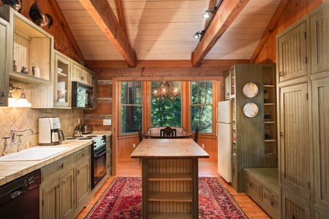 Full kitchen with full stove, dishwasher, coffee maker, and more