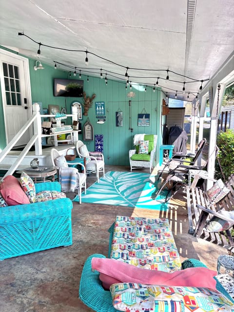Outdoor room with tv and gas grill