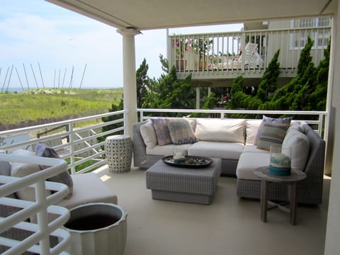 Covered Deck has a comfortable sectional for lounging and relaxing
