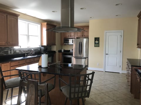 Large chief's kitchen with island, plenty of room to prepare food for everyone!