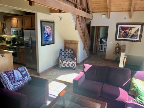 Living room, stairway down to garage, entry to Bedroom #2
