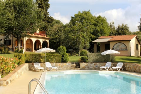 Seasonal outdoor pool, open 8:00 AM to 7:00 PM, pool umbrellas