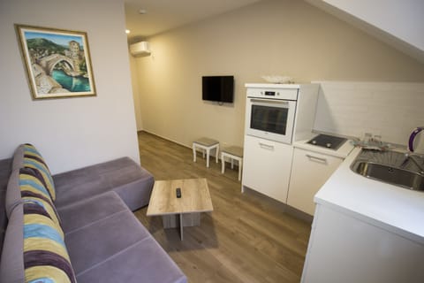 Apartment | Living area | TV, toys, books, heated floors