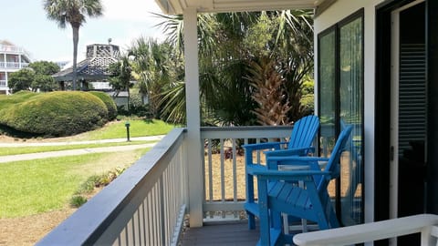 Enjoy your porch and a view of the tropical landscape.