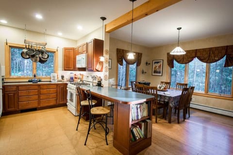Kitchen with counter and dining area.