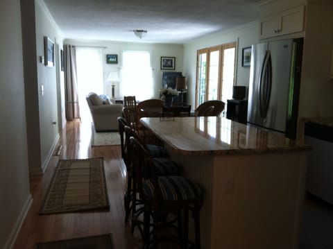 Kitchen and Living Room. Walk out to deck and screen porch.