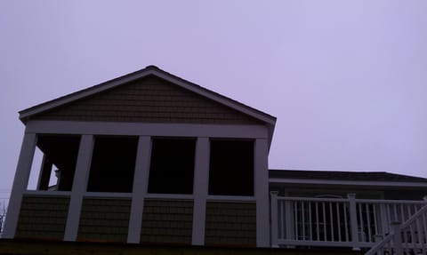 Screen Porch and deck off living area. Wonderful living space and great sunsets!