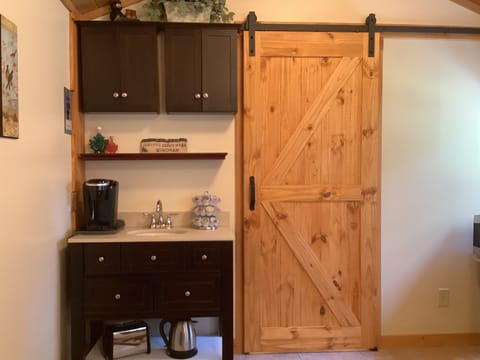 kitchenette has Keurig coffee unit - barn door slides to access the bathroom 