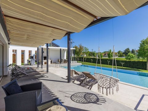 Water, Property, Building, Plant, Shade, Sky, Swimming Pool, Outdoor Furniture, Tree, Condominium