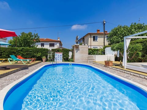 Blue, Swimming Pool, Outdoor Furniture, Shade, Landscaping, Resort, Eco Hotel, Backyard, Houseplant, Hotel