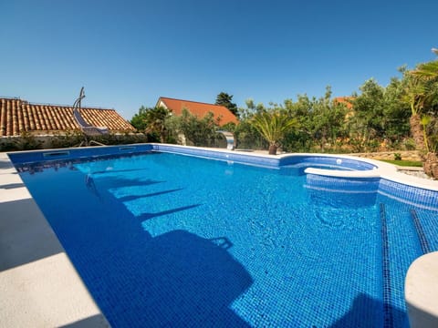Blue, Swimming Pool, Resort, Eco Hotel, Outdoor Furniture, Estate, Umbrella, Leisure, Hotel, Villa