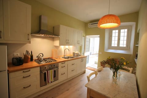 The kitchen with a door leading into the garden