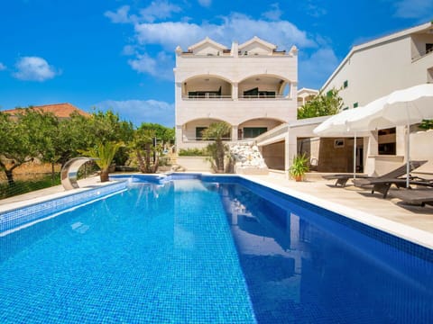 Blue, Swimming Pool, Resort, Leisure, Eco Hotel, Outdoor Furniture, Shade, Landscaping, Water Feature