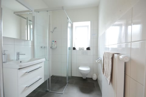 New. Shower bathroom with hairdryer.