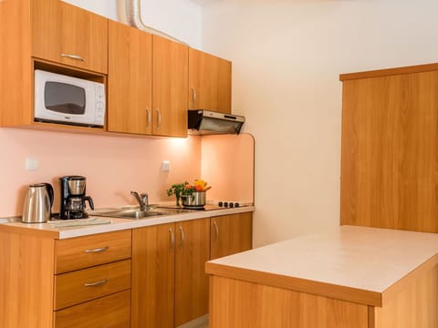 Cabinetry, Room, Kitchen, Furniture, Property, Countertop, Plywood, Interior Design, Yellow, House