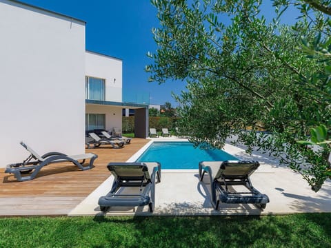 Property, Water, Building, Furniture, Swimming Pool, Azure, Sky, Plant, Outdoor Furniture, Sunlounger