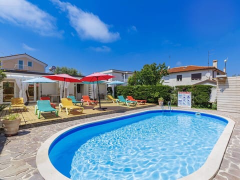 Outdoor Furniture, Chair, Shade, Swimming Pool, Outdoor Table, Yard, Landscaping, Resort, Umbrella, Eco Hotel