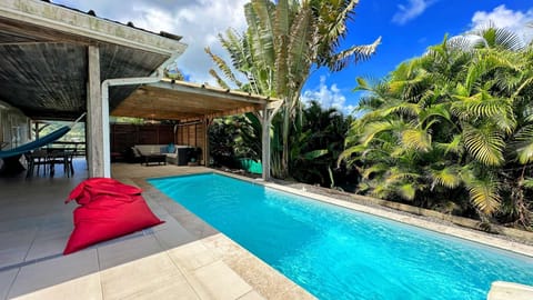 Large covered terrace with lounge and dining area