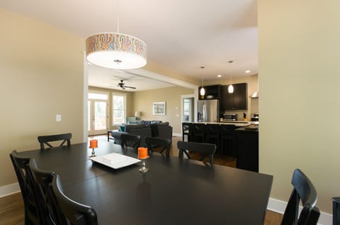 Dining room table and view of kitchen and living room 