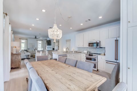 Open-concept dining, kitchen, and living areas. A perfect place for gathering!