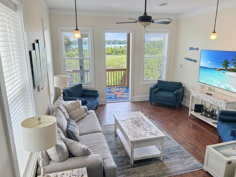 Main room. Great views, balcony, lots of seating, 75' TV and opens to kitchen.