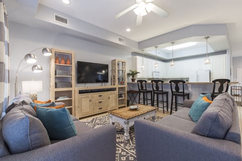 Spacious living area and kitchen bar with extra seating.