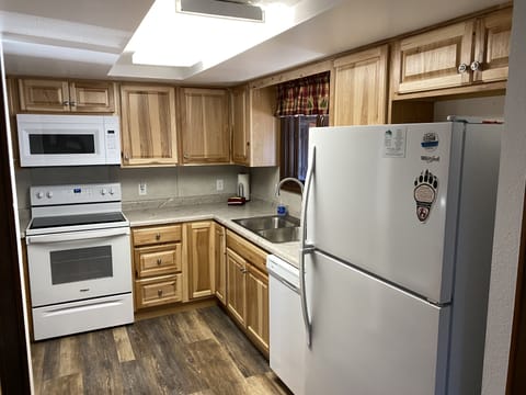 Kitchen off of the dining room. Coffee pot,microwave,dishwasher,stove & fridge.
