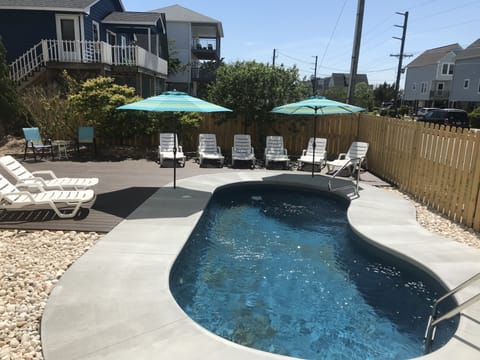 New saltwater pool with lots of deck space and lounge chairs