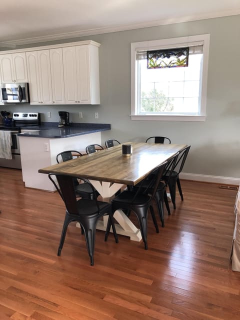 Dining table seats 8, 2  seats at the counter, 4 seats at island. Total 14