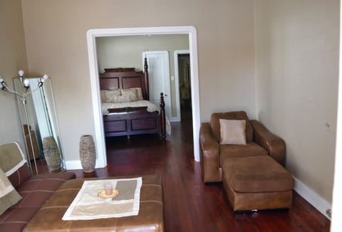 Living room with French doors leading to the first bedroom. 