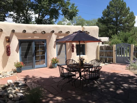 Private flagstone patio facing south with your parking spot just outside