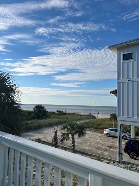 View from SE corner of front deck. Path to beach & ocean steps away from house.
