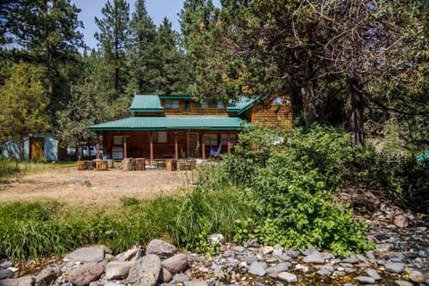 Gorgeous back porch, fire pit and creek right out your back door.