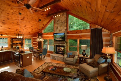 Light and bright den (with Smart TV) open  to fireplace, dining area,and kitchen