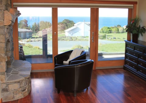 MASTER SUITE: Ocean views from bed!  Gorgeous rock fireplace & sitting area!