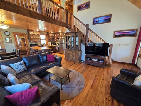 Comfortable leather sectional in the main living area. 