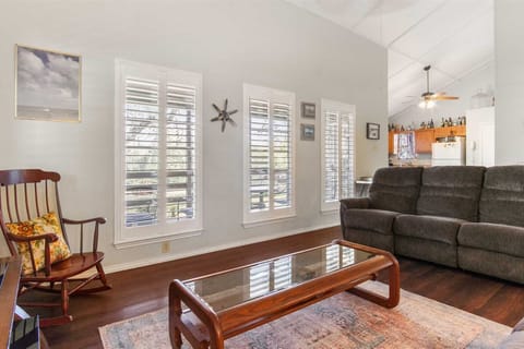 Sun-drenched spaces and open living! Our vacation rental boasts a bright and airy living room with views leading right into the well-equipped kitchen, perfect for seamless entertaining and relaxation.