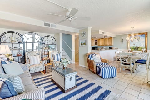 Living Area with Ample Seating, Large Flat Screen TV and Balcony Access