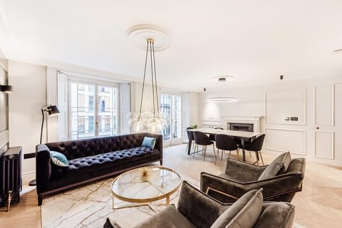 Open-plan living and dining area with stunning french doors and original shutter