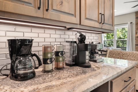 Numerous cups and machines for coffee lovers