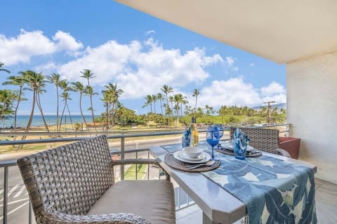 Enjoy breakfast on your private balcony with sparkling ocean views and swaying palms